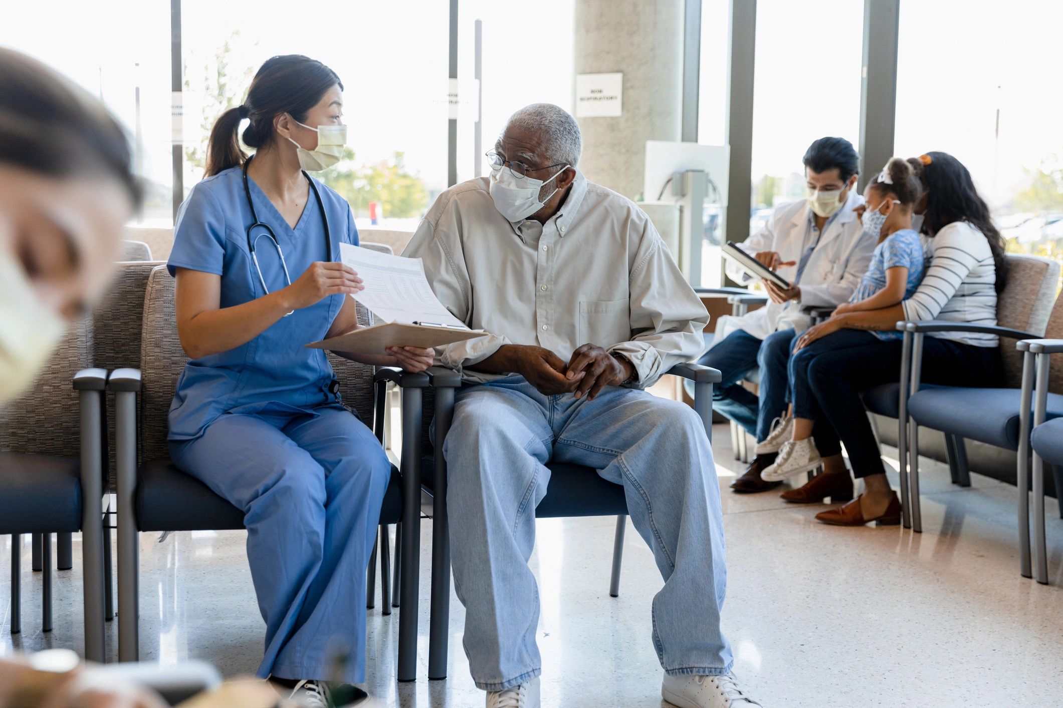 Doctor speaking with an elderly patient