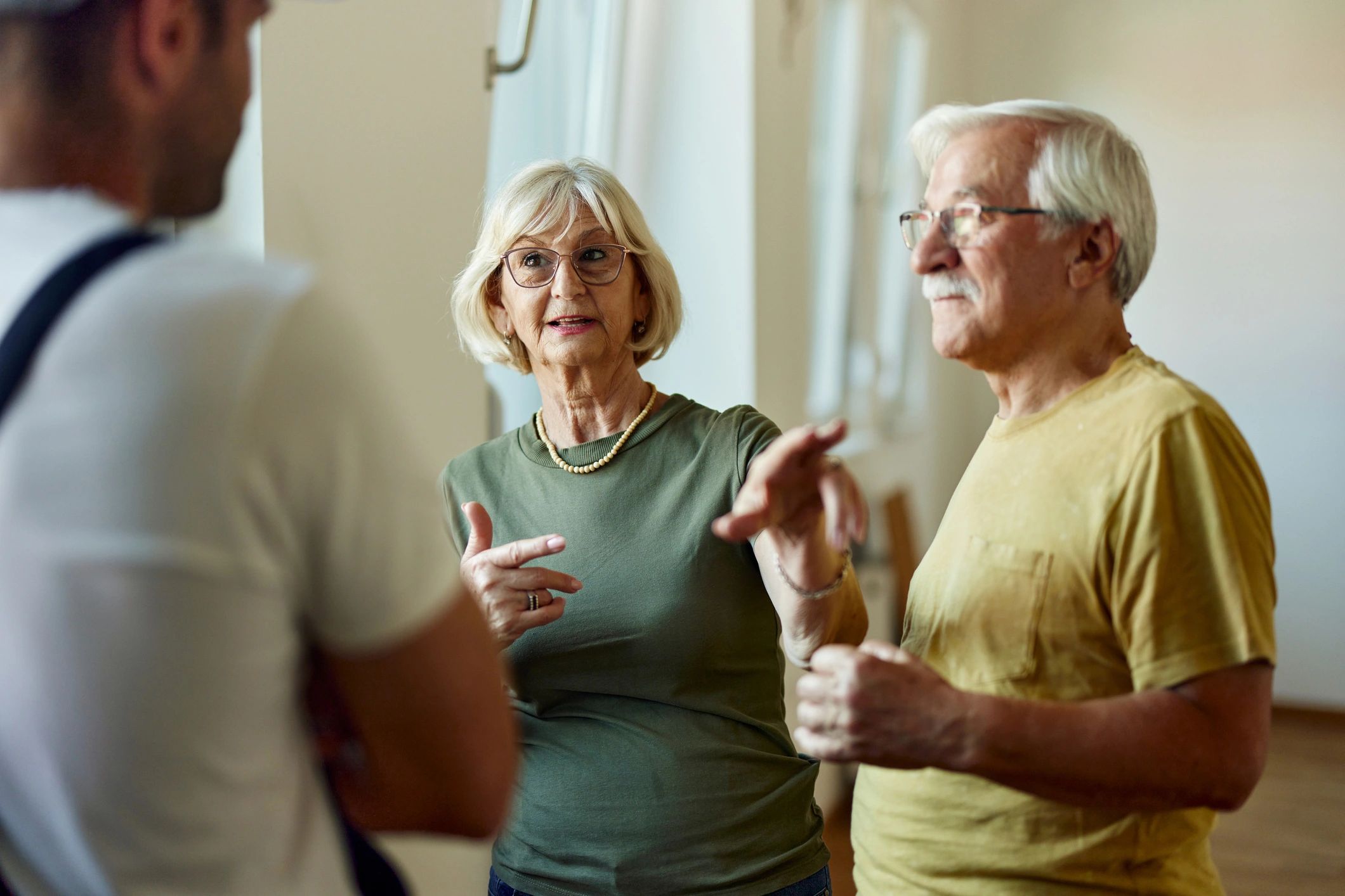Senior couple speaking with a support professional